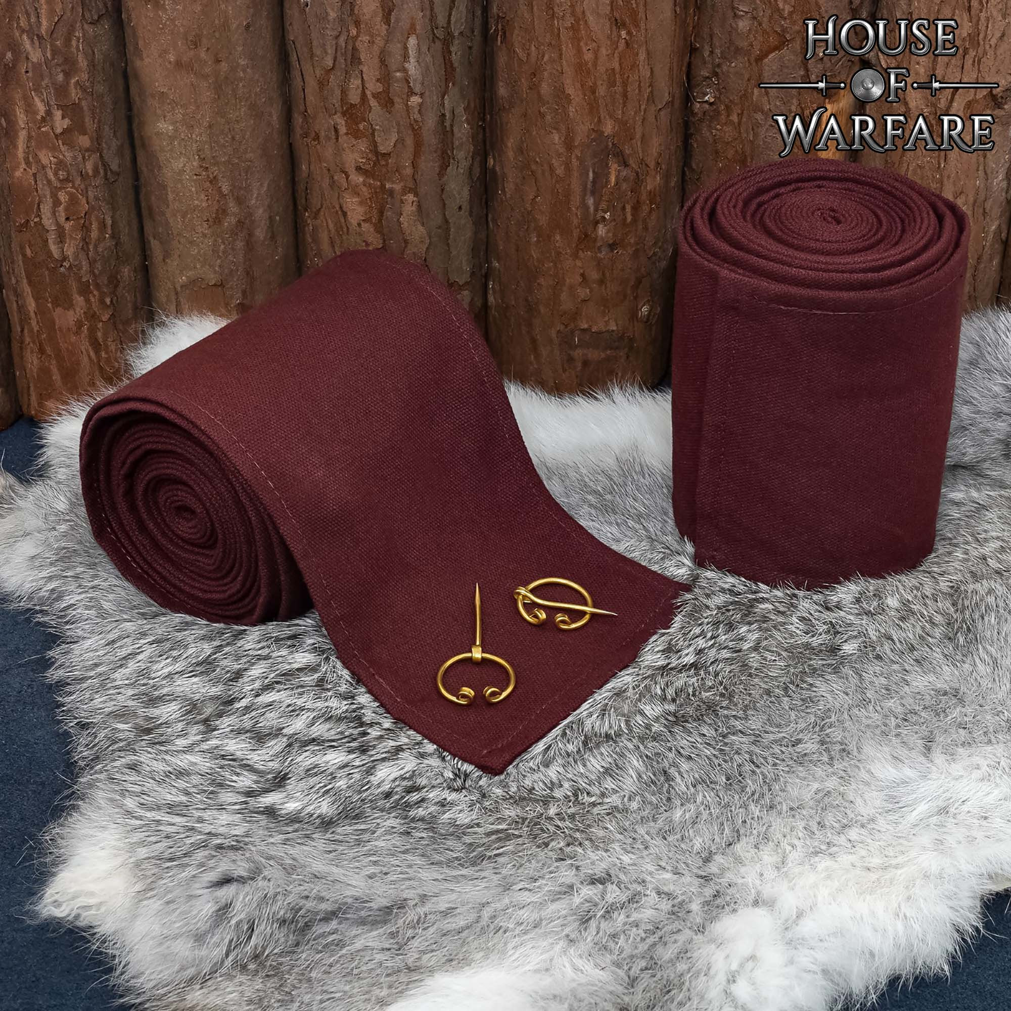 Winingas medievales en algodón marrón, con fibulas de latón